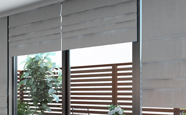 Elegant motorized roman shades with smart home integration